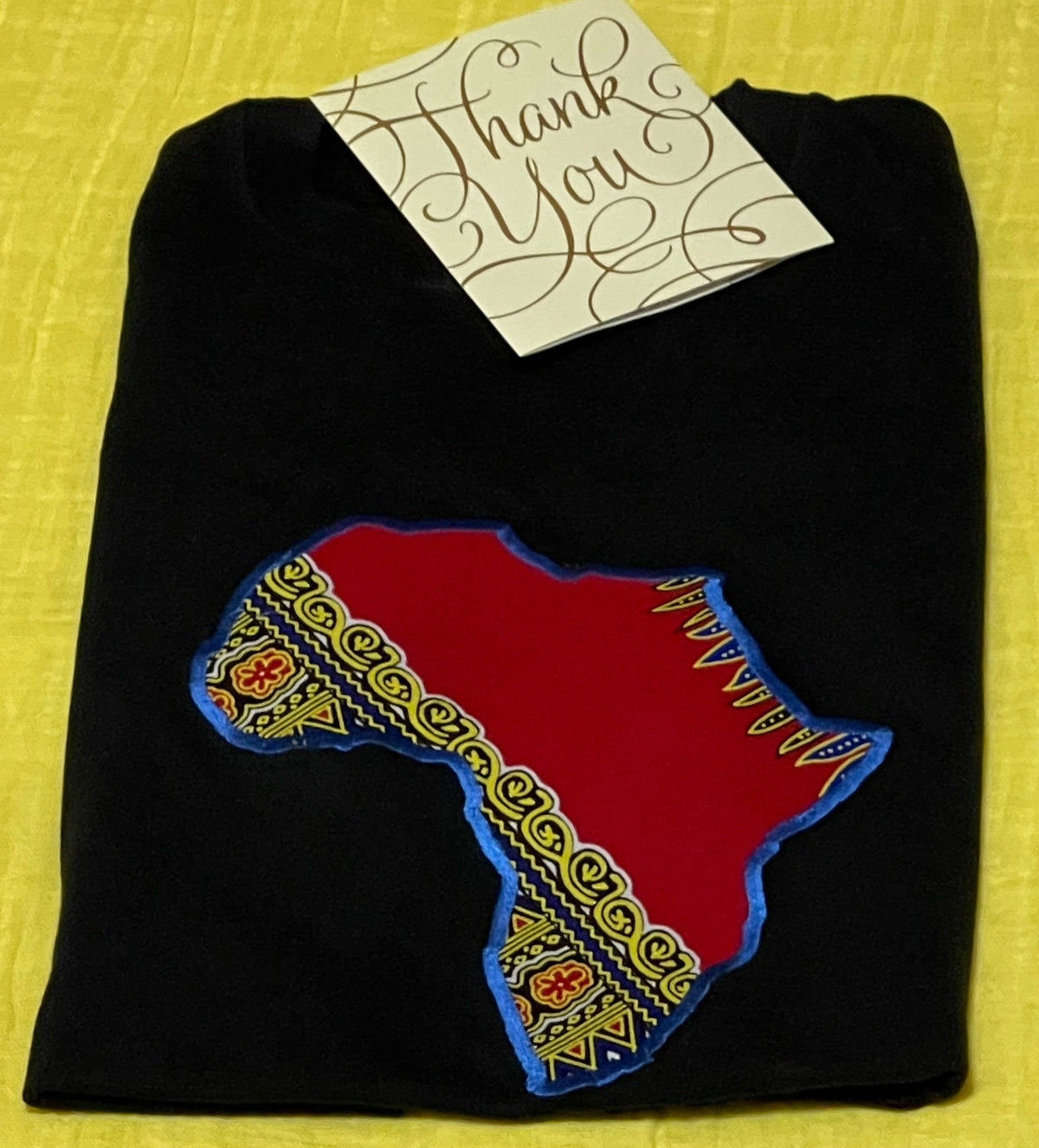 Red Dashiki appliqué T-shirt folded
